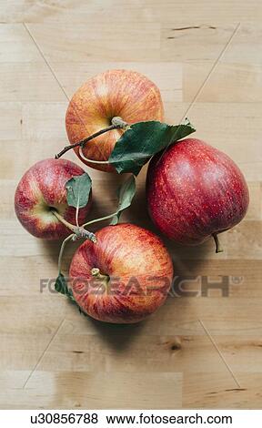 Four red apples View Large Photo Image Stock Photo - Four red apples. Fotosearch