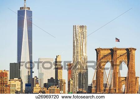Stock Image - Freedom Tower and Brooklyn Bridge. Fotosearch