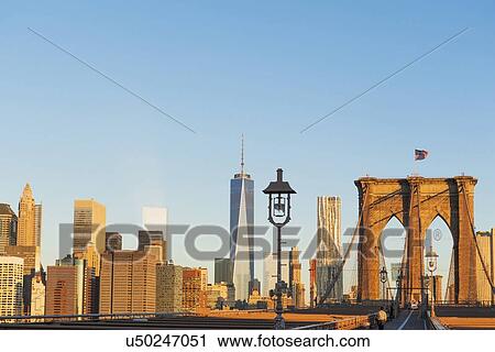 Stock Image - Freedom Tower and Brooklyn Bridge. Fotosearch