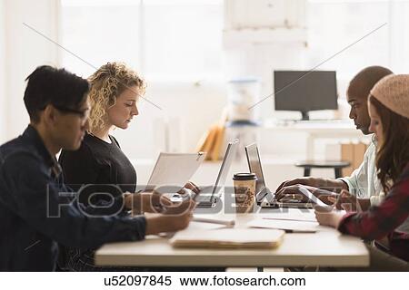 Friends having business meeting in office View Large Photo Image Stock Photography - Friends having business meeting in office. Fotosearch