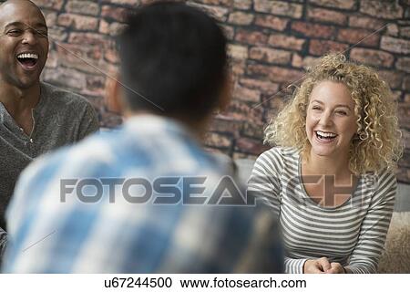 Friends laughing together View Large Photo Image Stock Image - Friends laughing together. Fotosearch