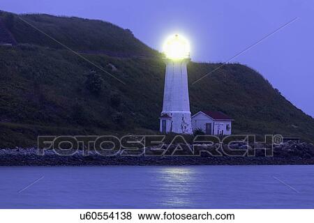 Georges Island Lighthouse on rocky coast at dawn View Large Photo Image Stock Photo - Georges Island Lighthouse on rocky coast at dawn. Fotosearch