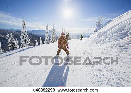 Girl (8-9) skiing in mountains View Large Photo Image Stock Photo - Girl (8-9) skiing in mountains. Fotosearch