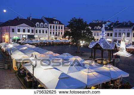Stock Photography - High angle view of market square at night. Fotosearch