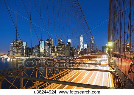 Illuminated Brooklyn Bridge at night View Large Photo Image Picture - Illuminated Brooklyn Bridge at night. Fotosearch