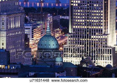 Stock Photo - Illuminated city architecture. Fotosearch