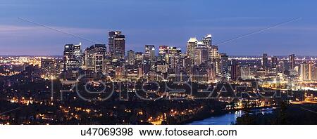 Illuminated cityscape at dusk View Large Photo Image Stock Photo - Illuminated cityscape at dusk. Fotosearch