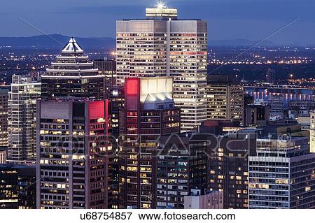 Stock Photo - Illuminated cityscape at dusk. Fotosearch