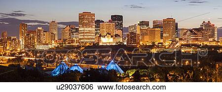 Illuminated cityscape at dusk View Large Photo Image Stock Photograph - Illuminated cityscape at dusk. Fotosearch