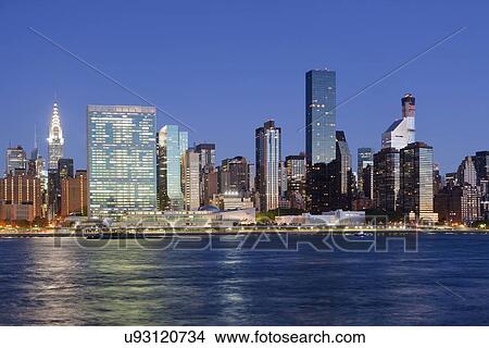 Illuminated cityscape at night View Large Photo Image Picture - Illuminated cityscape at night. Fotosearch