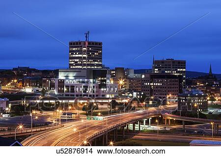 Illuminated overcrossing in city at dusk View Large Photo Image Picture - Illuminated overcrossing in city at dusk. Fotosearch