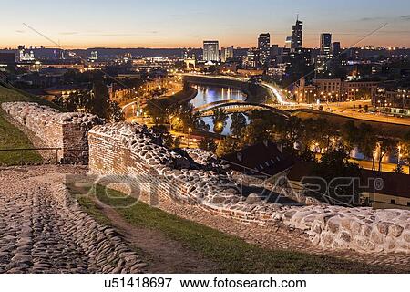 Illuminated riverfront cityscape seen from elevation on opposite bank View Large Photo Image Stock Photo - Illuminated riverfront cityscape seen from elevation on opposite bank. Fotosearch