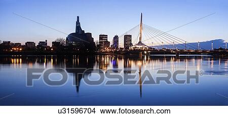 Illuminated skyline reflecting in calm Assiniboine River View Large Photo Image Picture - Illuminated skyline reflecting in calm Assiniboine River. Fotosearch