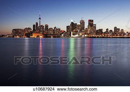 Illuminated skyline seen from lake View Large Photo Image Picture - Illuminated skyline seen from lake. Fotosearch
