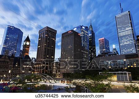 Illuminated skyscrapers against sky View Large Photo Image Stock Photography - Illuminated skyscrapers against sky. Fotosearch