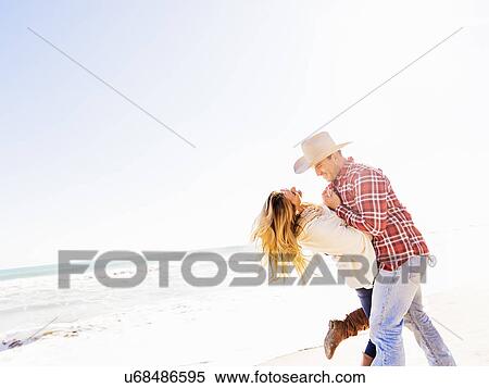 Loving couple on beach View Large Photo Image Stock Photography - Loving couple on beach. Fotosearch