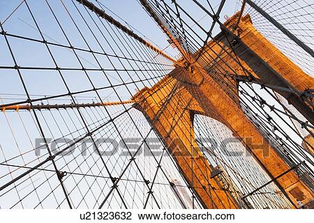 Stock Image - Low angle view of Brooklyn Bridge. Fotosearch