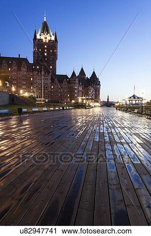 Low angle view of wooden pier and illuminated Chateau Frontenac at dawn View Large Photo Image Stock Image - Low angle view of wooden pier and illuminated Chateau Frontenac at dawn. Fotosearch