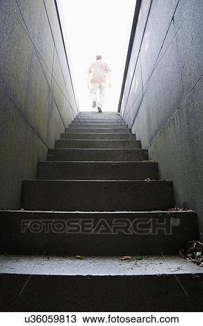 Man at top of stone stairway View Large Photo Image Stock Image - Man at top of stone stairway. Fotosearch