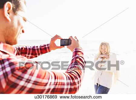 Man taking picture of woman View Large Photo Image Stock Photo - Man taking picture of woman. Fotosearch