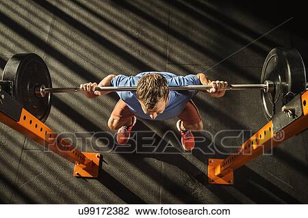 Mature man doing squats View Large Photo Image Stock Image - Mature man doing squats. Fotosearch