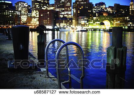 Metal ladder along commercial pier with Boston Waterfront in background View Large Photo Image Stock Photo - Metal ladder along commercial pier with Boston Waterfront in background. Fotosearch