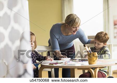 Mother playing with daughter and son (4-5, 6-7) View Large Photo Image Stock Photo - Mother playing with daughter and son (4-5, 6-7). Fotosearch