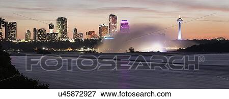 Niagara Falls and Toronto skyline in background View Large Photo Image Stock Photo - Niagara Falls and Toronto skyline in background. Fotosearch