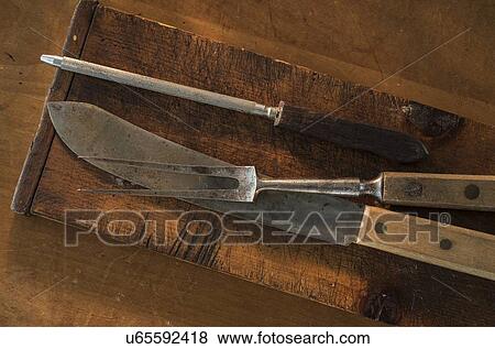 Stock Photo - Old kitchen utensils on wood. Fotosearch