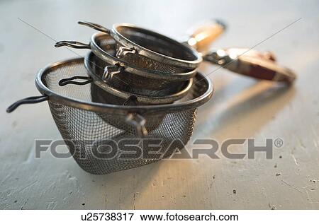 Old sieves on white View Large Photo Image Stock Photo - Old sieves on white. Fotosearch
