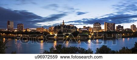 Panoramic view of city and river at dusk View Large Photo Image Stock Photo - Panoramic view of city and river at dusk. Fotosearch