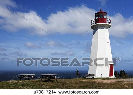 Picture - Picnic tables next to Cape George Lighthouse with sea on background. Fotosearch
