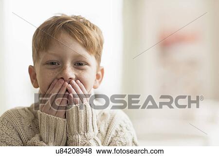 Portrait of boy (6-7) with hands covering mouth View Large Photo Image Stock Photo - Portrait of boy (6-7) with hands covering mouth. Fotosearch