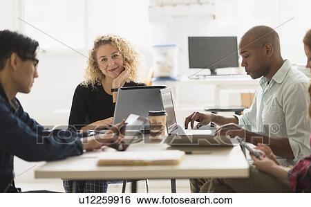Portrait of businesswoman during meeting in office View Large Photo Image Stock Photograph - Portrait of businesswoman during meeting in office. Fotosearch