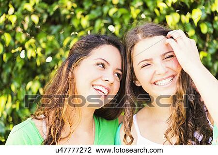 Stock Image - Portrait of female friends (14-15). Fotosearch