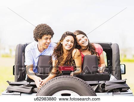 Portrait of friend (14-15) during road trip View Large Photo Image Stock Image - Portrait of friend (14-15) during road trip. Fotosearch