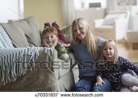 Portrait of happy mother with children (4-5, 6-7) View Large Photo Image Stock Photo - Portrait of happy mother with children (4-5, 6-7) . Fotosearch