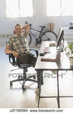 Portrait of man in office View Large Photo Image Picture - Portrait of man in office. Fotosearch