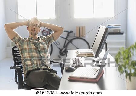 Stock Image - Portrait of man in office. Fotosearch