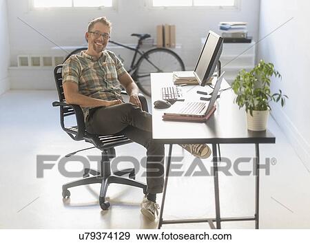 Portrait of man in office View Large Photo Image Stock Photo - Portrait of man in office. Fotosearch