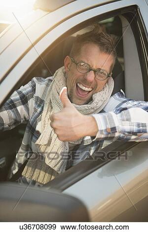 Stock Photo - Portrait of smiling car owner. Fotosearch