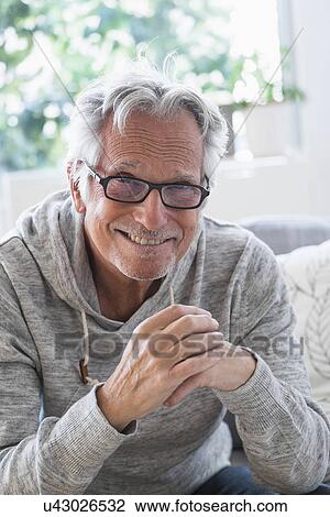 Stock Image - Portrait of smiling senior man. Fotosearch