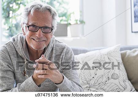 Stock Photograph - Portrait of smiling senior man. Fotosearch