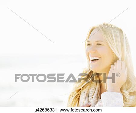 Stock Image - Portrait of smiling woman. Fotosearch