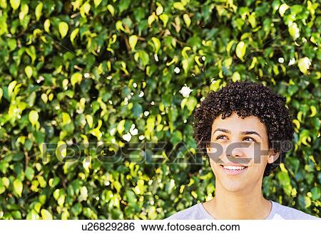 Stock Photograph - Portrait of smiling young man. Fotosearch
