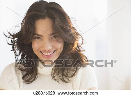 Portrait of smiling young woman View Large Photo Image Stock Photo - Portrait of smiling young woman. Fotosearch