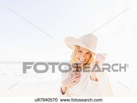 Portrait of woman in cowboy hat on beach View Large Photo Image Stock Image - Portrait of woman in cowboy hat on beach. Fotosearch