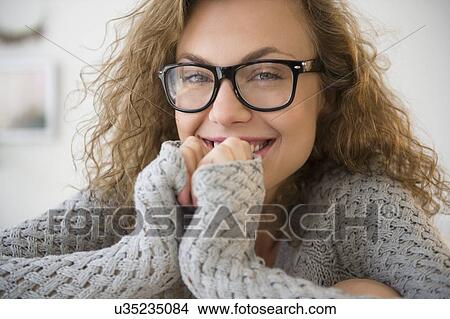 Portrait of young blond woman wearing glasses View Large Photo Image Picture - Portrait of young blond woman wearing glasses. Fotosearch