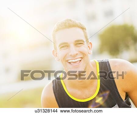 Picture - Portrait of young man smiling. Fotosearch