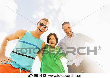 Portrait of young people having fun outdoors View Large Photo Image Stock Image - Portrait of young people having fun outdoors. Fotosearch